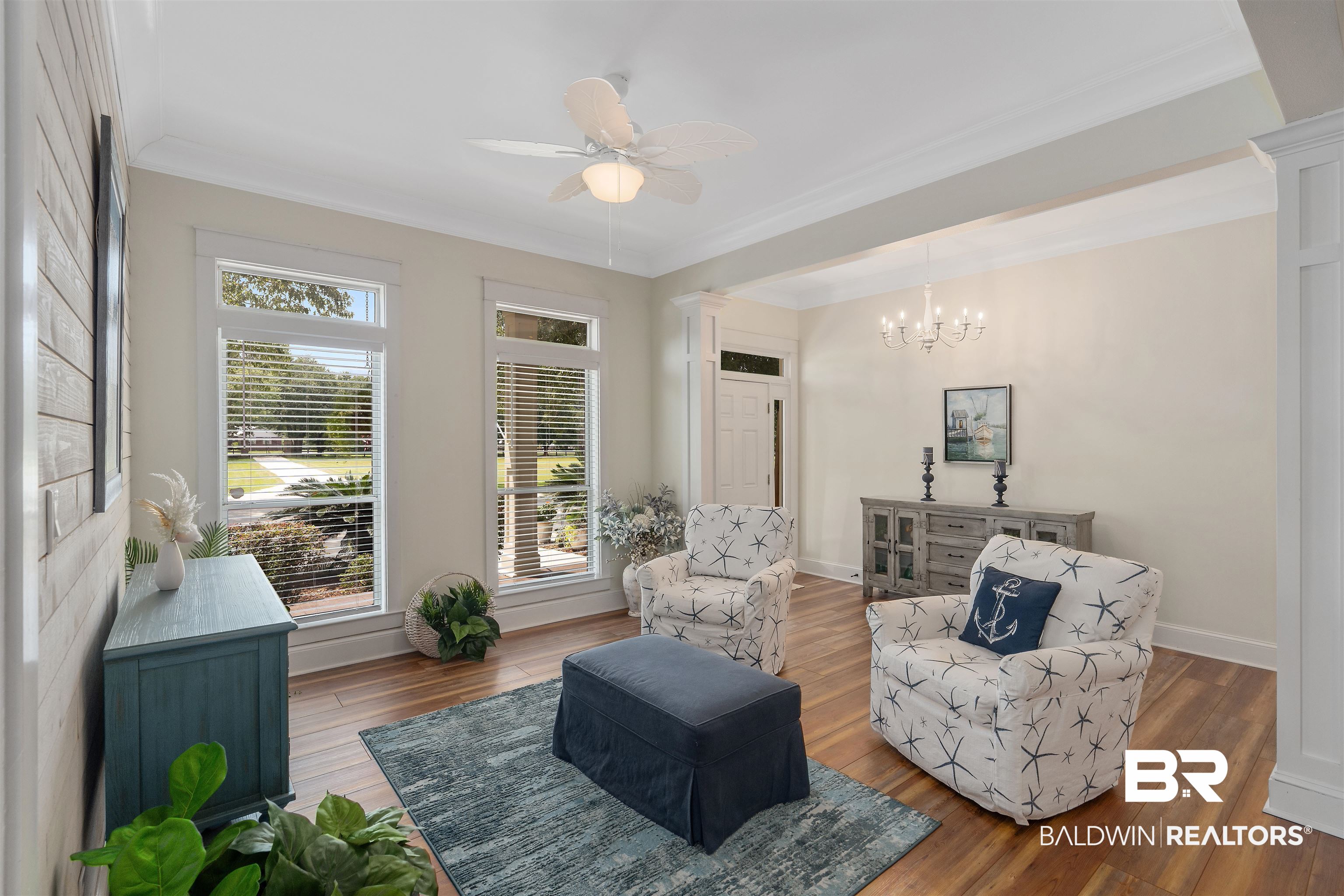 16330 Danne Road Fairhope, AL 36532 - Photo 5 of 43 Living area with ceiling fan with notable chandelier, plenty of natural light, hardwood / wood-style flooring, and crown molding