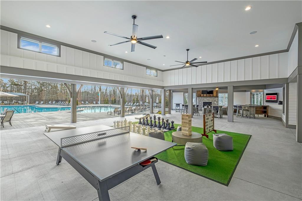 85 Loon Lk Way Hoschton, GA 30548 - Photo 3 of 9 a living room with lots of furniture and a table