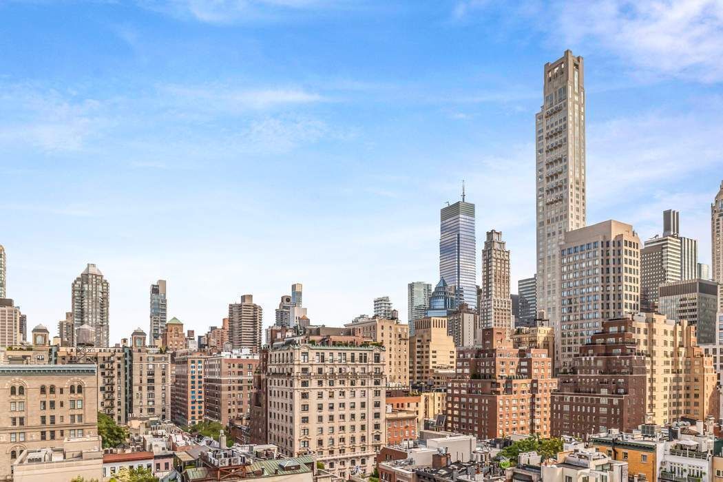 825 5th Avenue, Unit 12C Manhattan, NY 10065 - Photo 13 of 15 a view of a city with tall buildings