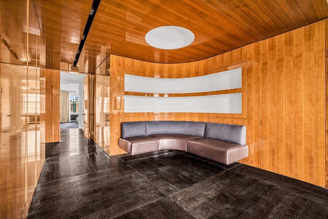 825 5th Avenue, Unit 12C Manhattan, NY 10065 - Photo 7 of 15 a bathroom with a sink and a mirror