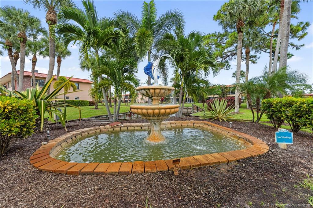 1941 Southwest Palm City Road, Unit B Stuart, FL 34994 - Photo 40 of 40 a view of a swimming pool with a patio