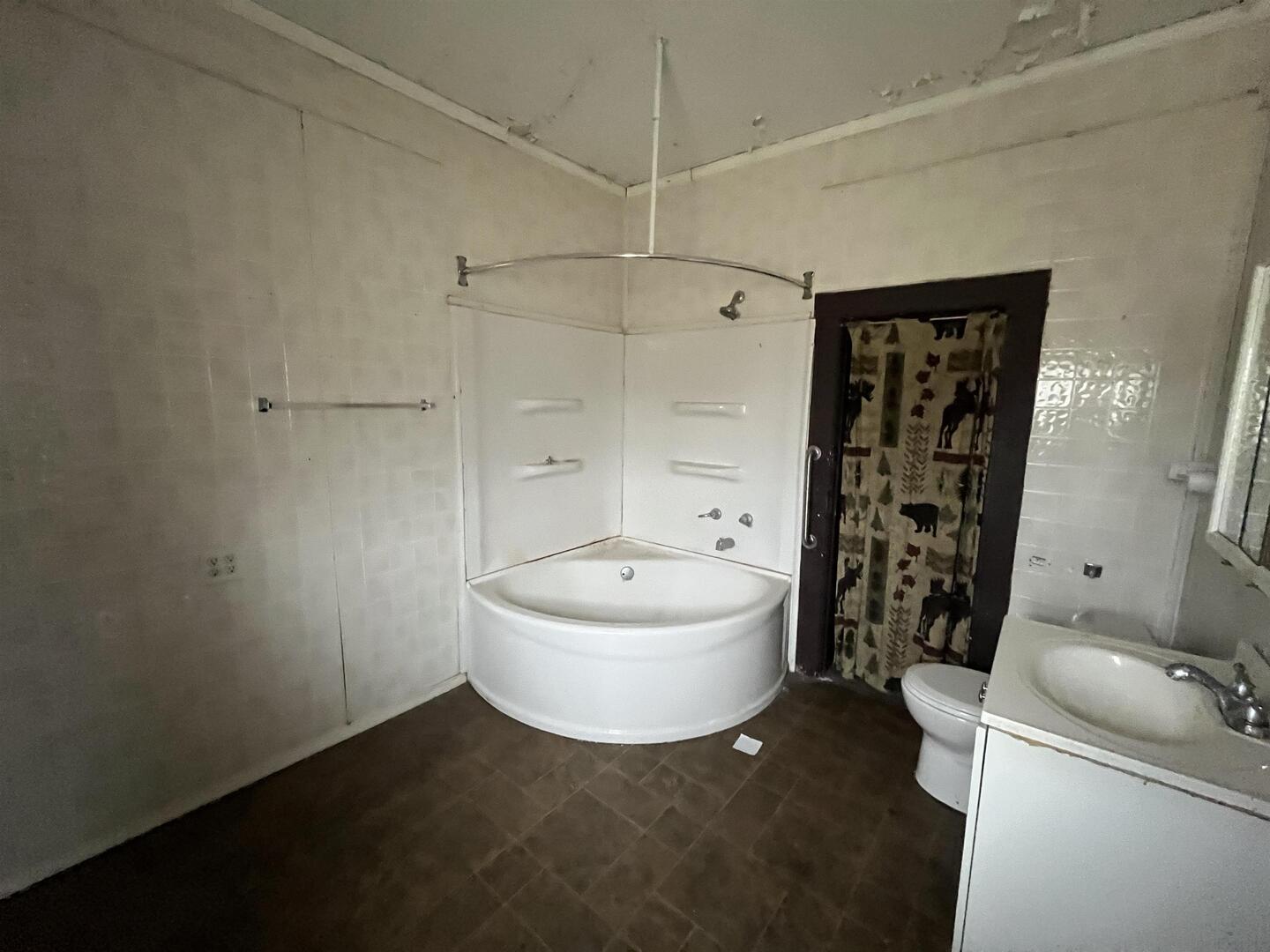 3302 Rockingham Road Davenport, IA 52802 - Photo 20 of 35 a bathroom with a sink a toilet and shower