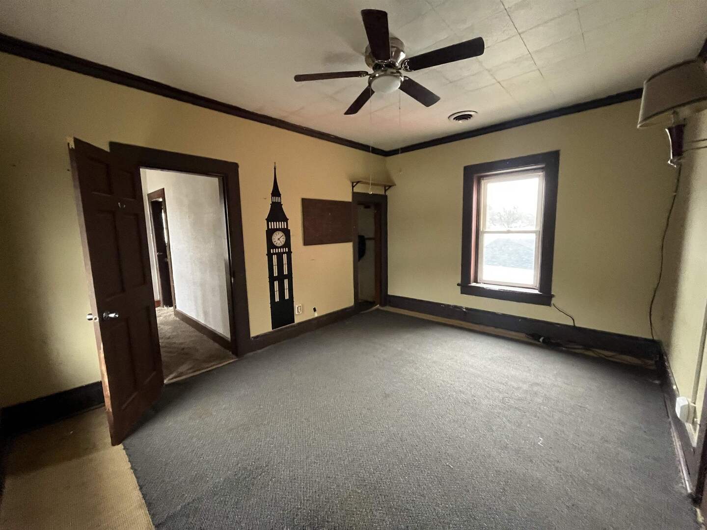 3302 Rockingham Road Davenport, IA 52802 - Photo 22 of 35 a view of a livingroom with a ceiling fan and window