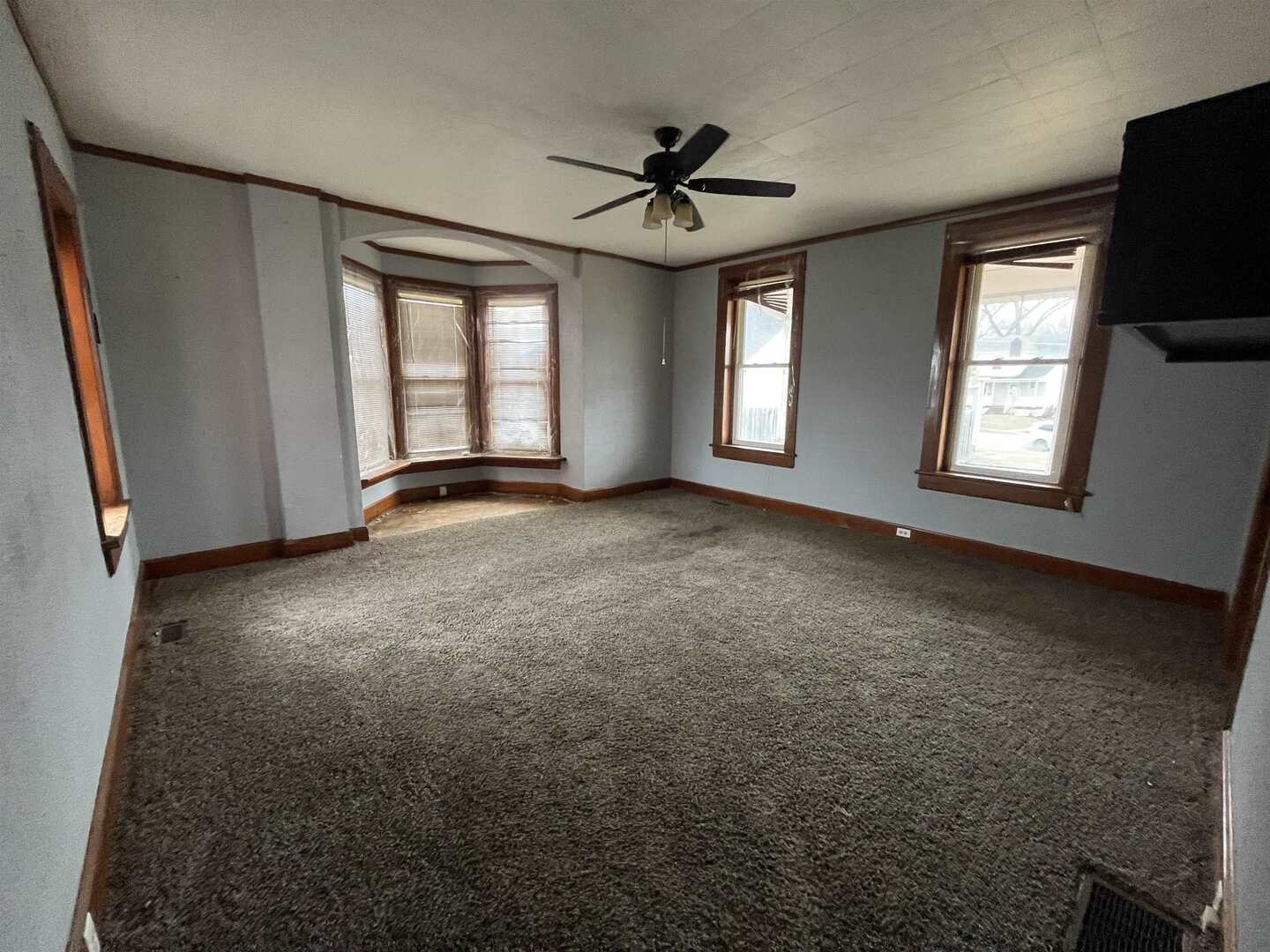 3302 Rockingham Road Davenport, IA 52802 - Photo 4 of 35 a view of an empty room with a window