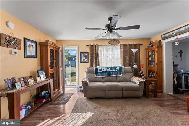 a living room with furniture and a window