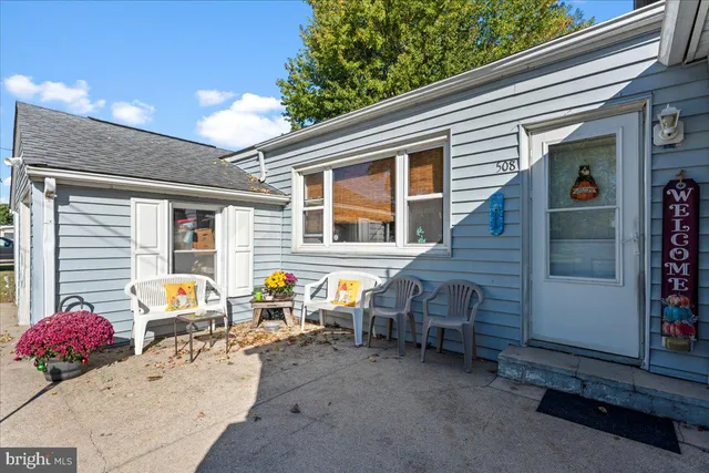 a view of a two chair in the back yard of the house