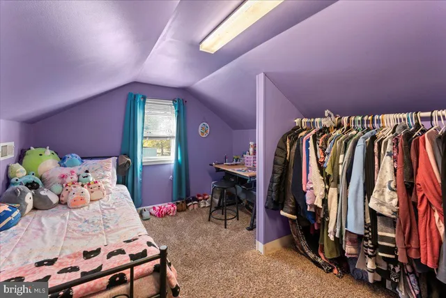 a bedroom with a bed and a closet