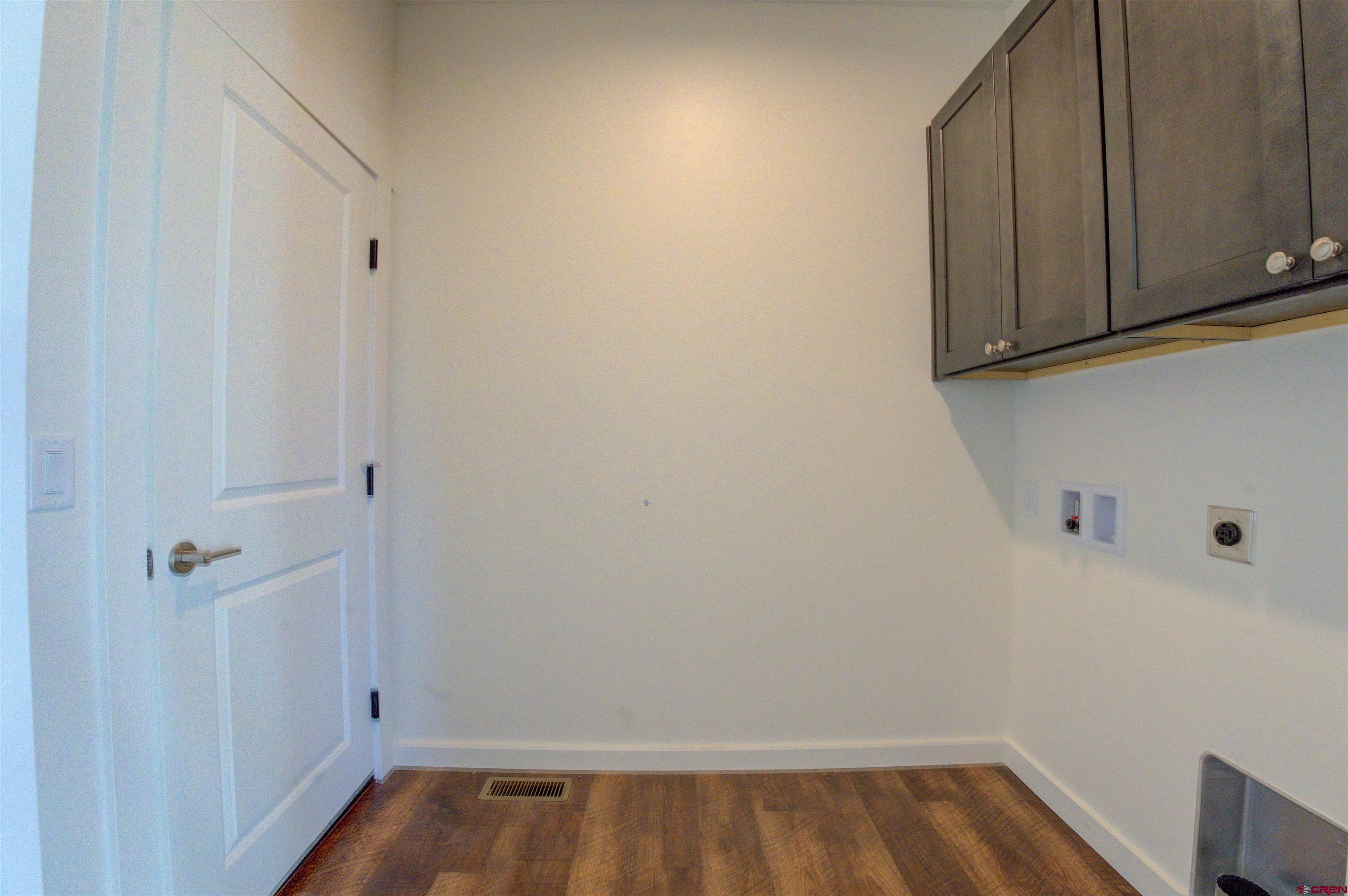 1678 Golf Course Lane Cortez, CO 81321 - Photo 20 of 28 a view of walk in closet with wooden floor