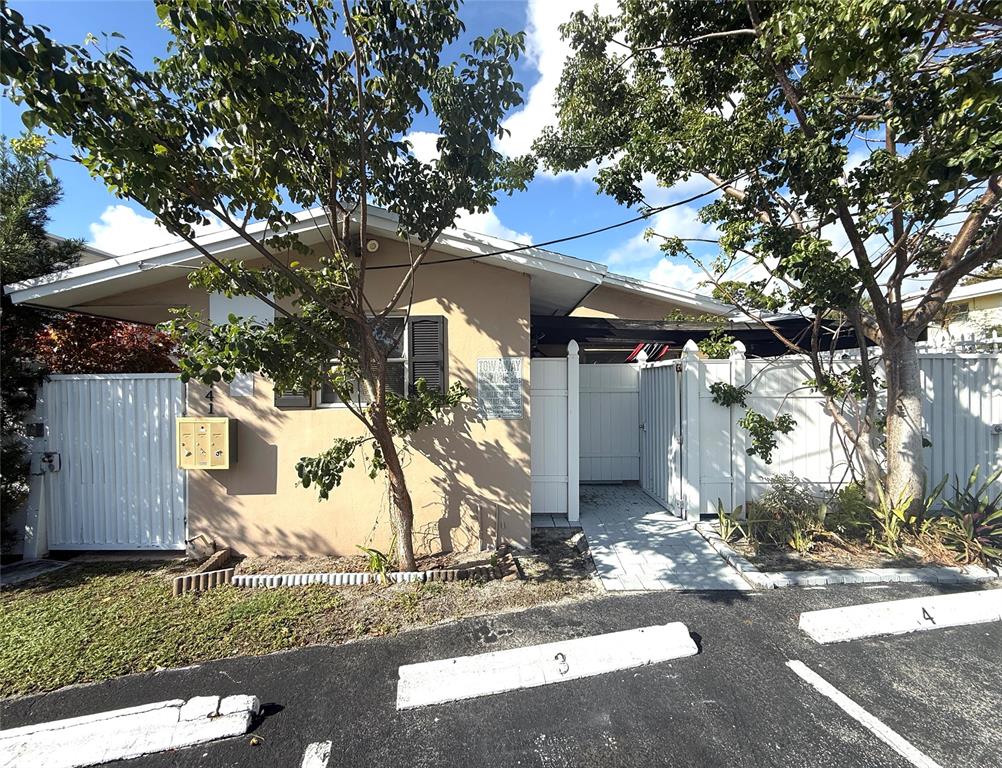 1441 Miami Road, Unit 1 Fort Lauderdale, FL 33316 - Photo 11 of 11 a front view of a house with a yard