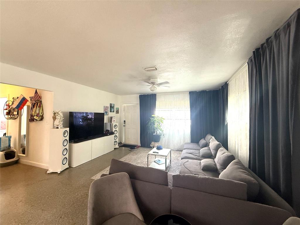 1441 Miami Road, Unit 1 Fort Lauderdale, FL 33316 - Photo 2 of 11 a living room with furniture and a flat screen tv