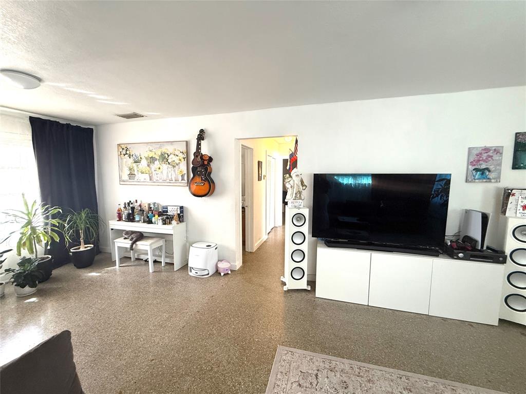 1441 Miami Road, Unit 1 Fort Lauderdale, FL 33316 - Photo 5 of 11 a living room with furniture and a flat screen tv