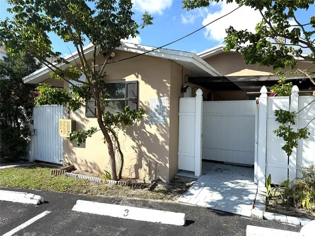a view of a house with a tree