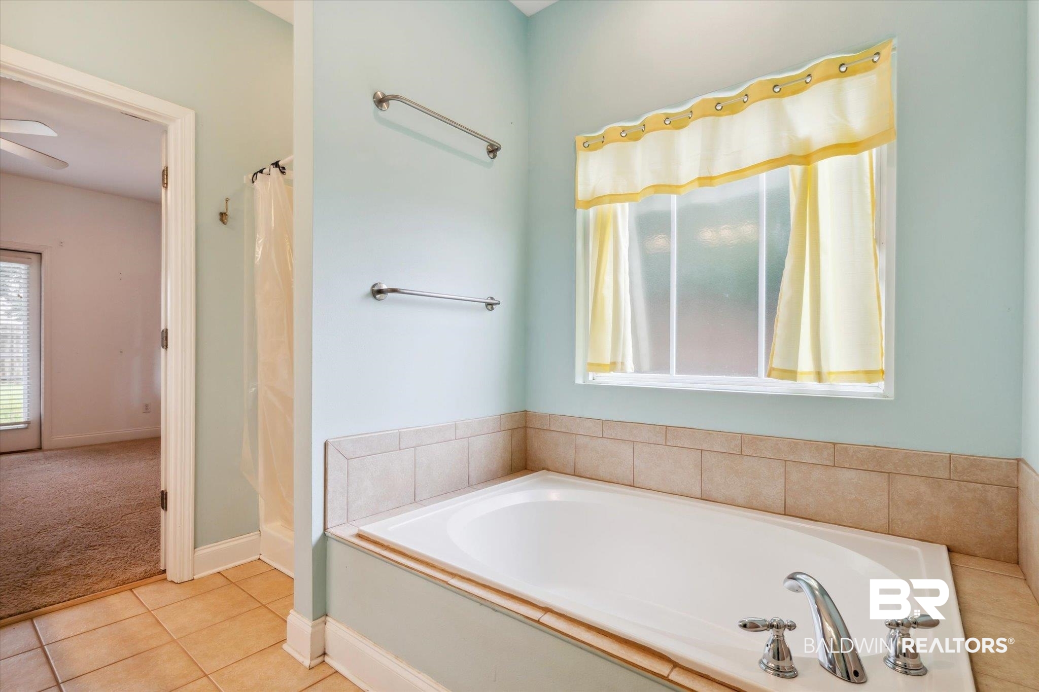 17297 Tallasee Boulevard Foley, AL 36535 - Photo 14 of 24 Bathroom featuring tile patterned flooring, ceiling fan, and a bath