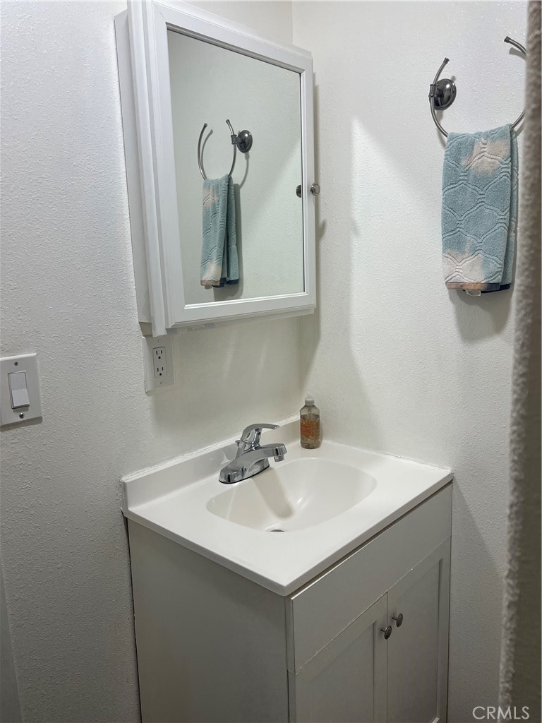 1331 Sao Paulo Avenue Placentia, CA 92870 - Photo 16 of 18 a bathroom with a sink and a mirror