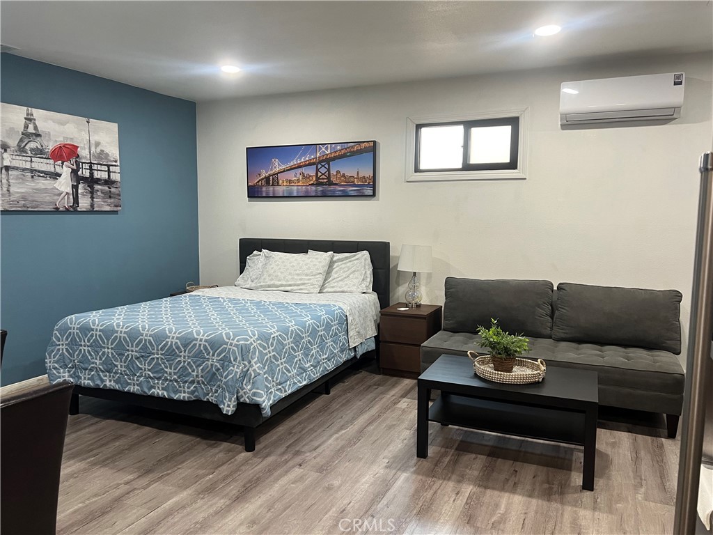 1331 Sao Paulo Avenue Placentia, CA 92870 - Photo 8 of 18 a bedroom with a bed a painting and a potted plant