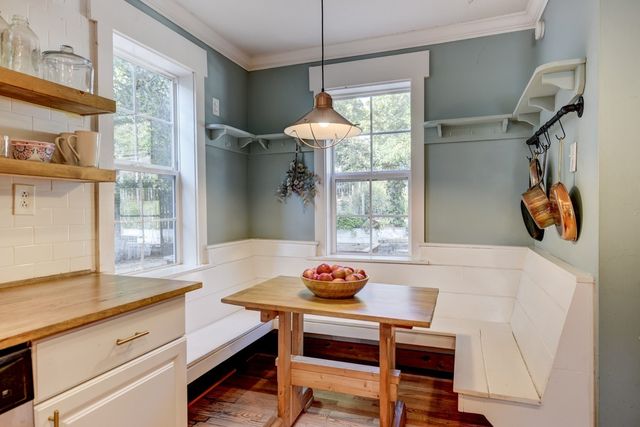a dining room with a table and chairs