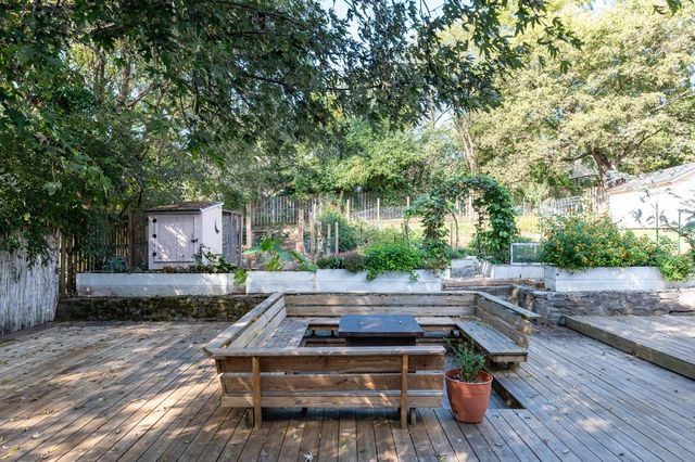 a backyard of a house with yard fire pit and outdoor seating
