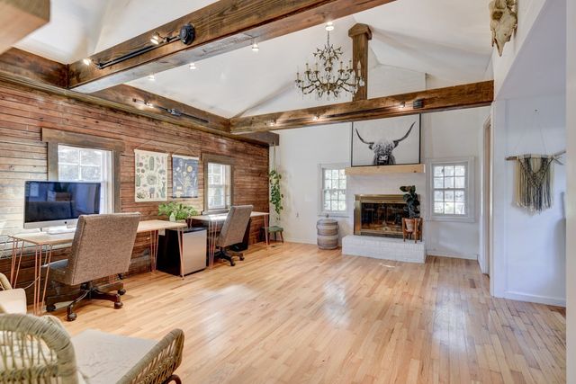 a view of a livingroom with furniture and a fireplace