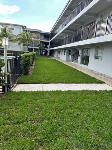 a view of house with a swimming pool