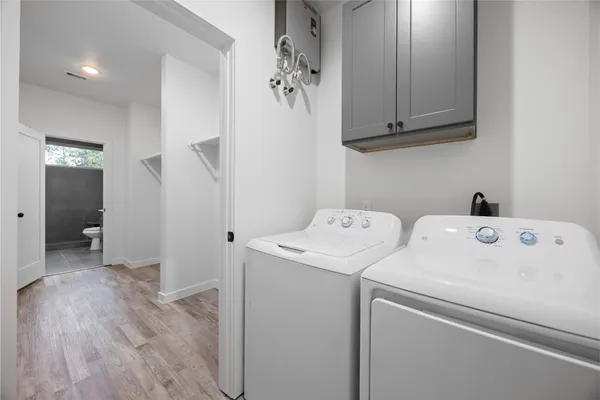 a view of storage and utility room with washer and dryer