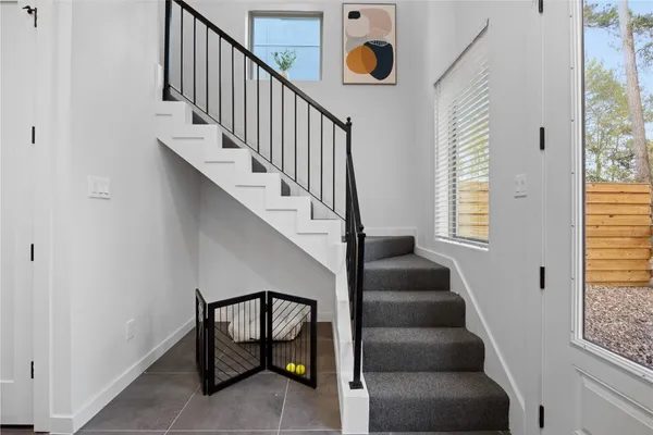 a view of entryway and hall with wooden floor