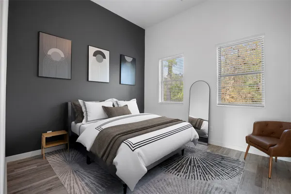 a bedroom with bed and a window