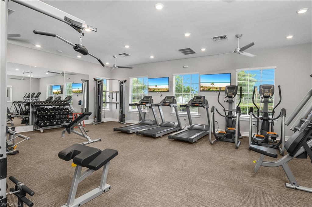 15436 Wildflower Circle Naples, FL 34119 - Photo 31 of 42 Gym featuring ceiling fan and recessed lighting
