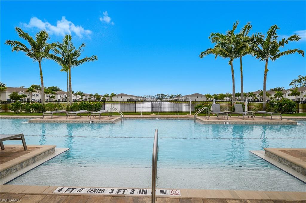 15436 Wildflower Circle Naples, FL 34119 - Photo 35 of 42 Community pool with a patio and a residential view