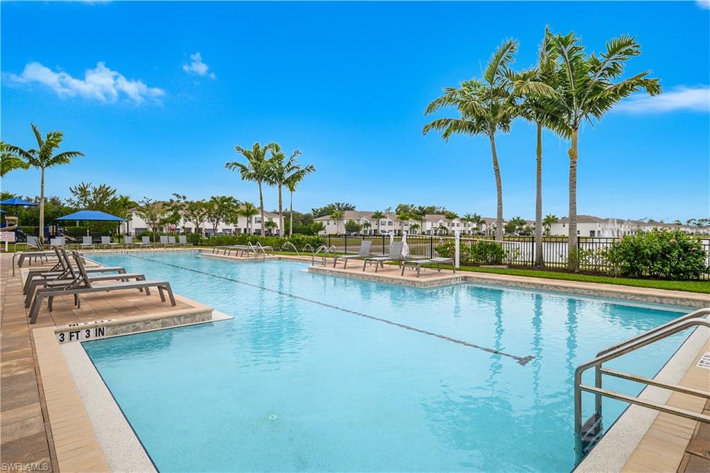 15436 Wildflower Circle Naples, FL 34119 - Photo 36 of 42 Community pool with a patio