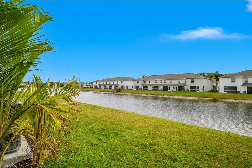 15436 Wildflower Circle Naples, FL 34119 - Photo 4 of 42 Water view with nearby suburban area