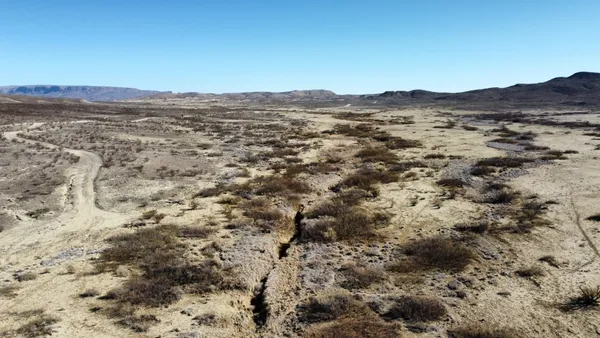 a view of mountain view with mountains in the background