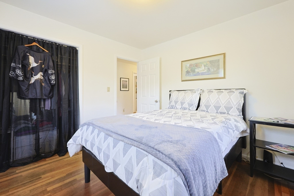 16 East New Lenox Road Lenox, MA 01240 - Photo 23 of 29 a bedroom with a bed and a painting on the wall