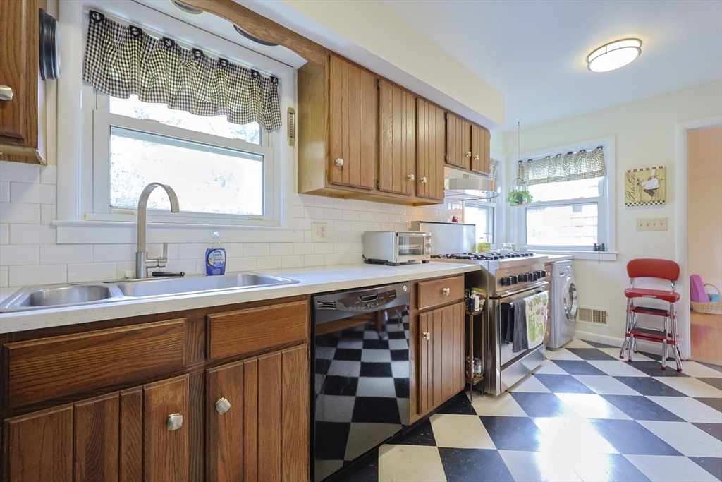 16 East New Lenox Road Lenox, MA 01240 - Photo 8 of 29 a kitchen with stainless steel appliances a sink stove and cabinets