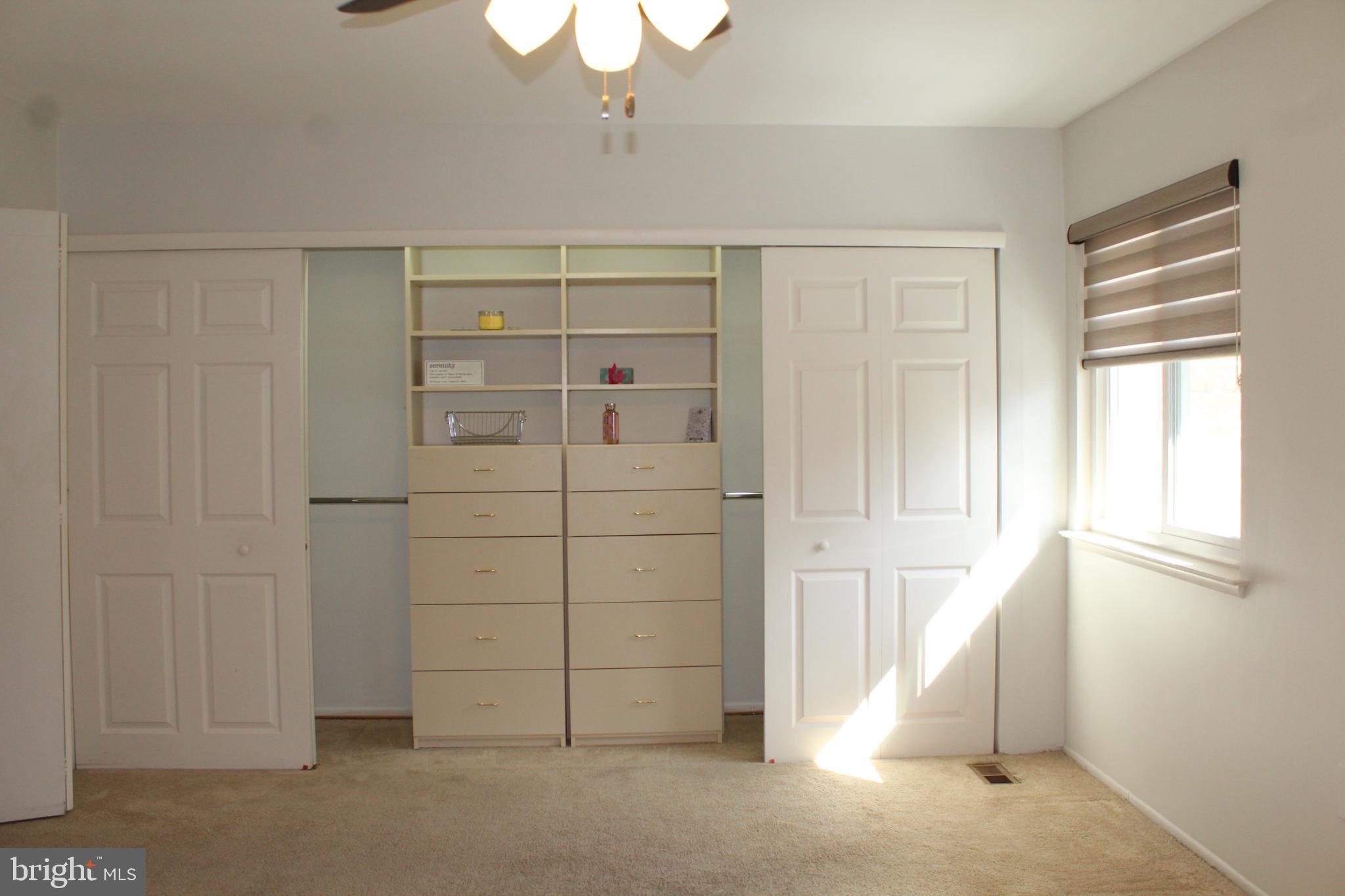 15002 Eardley Court, Unit 282B Silver Spring, MD 20906 - Photo 15 of 28 a view of walk in closet with window