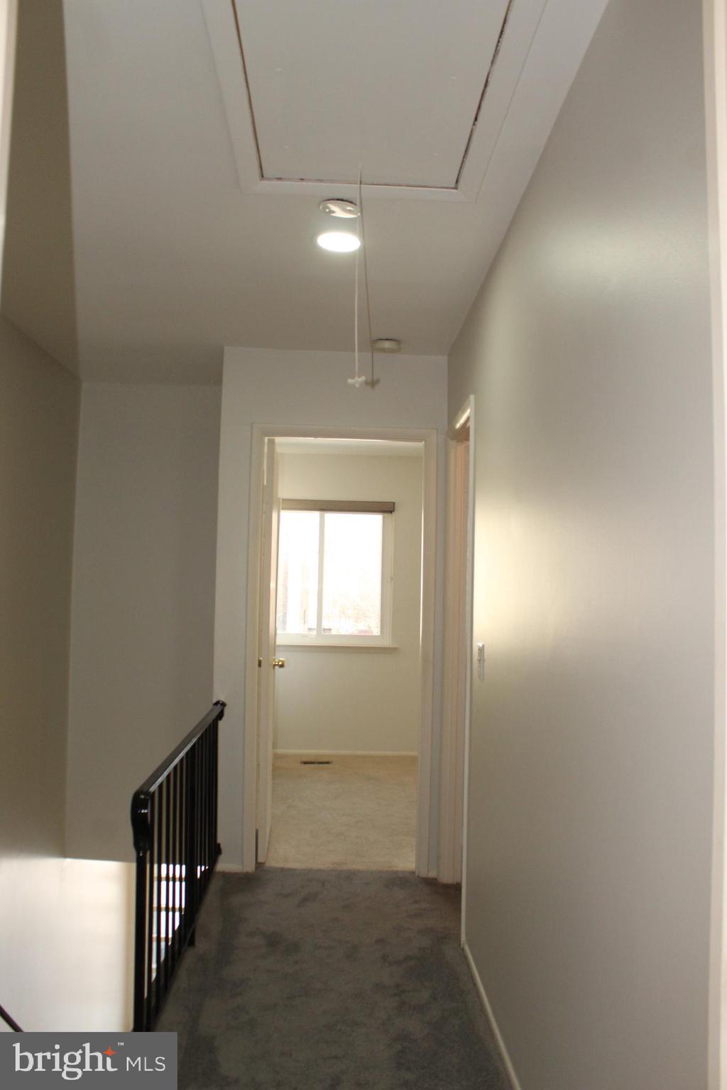15002 Eardley Court, Unit 282B Silver Spring, MD 20906 - Photo 20 of 28 a view of an empty room with wooden floor and a window