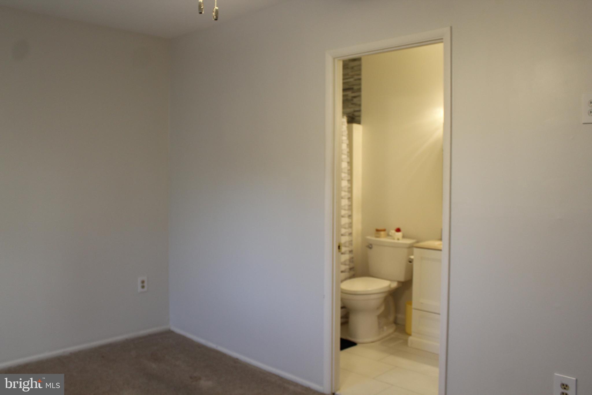 15002 Eardley Court, Unit 282B Silver Spring, MD 20906 - Photo 21 of 28 a bathroom with a toilet