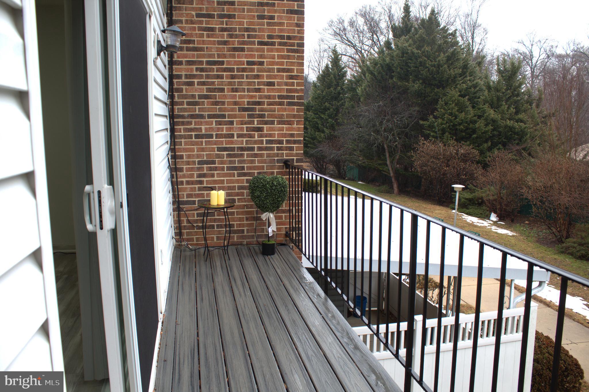 15002 Eardley Court, Unit 282B Silver Spring, MD 20906 - Photo 4 of 28 a view of balcony with wooden floor