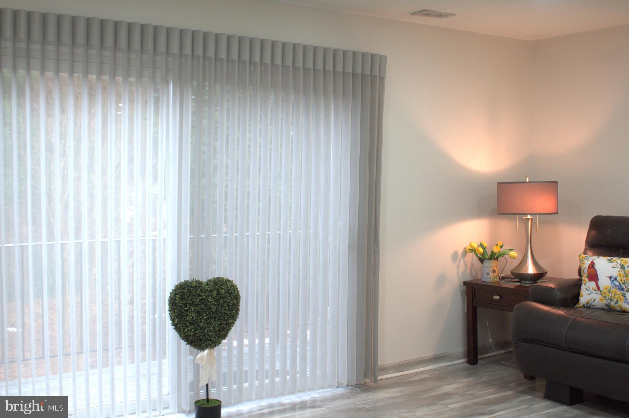 15002 Eardley Court, Unit 282B Silver Spring, MD 20906 - Photo 5 of 28 a room with furniture and a lamp