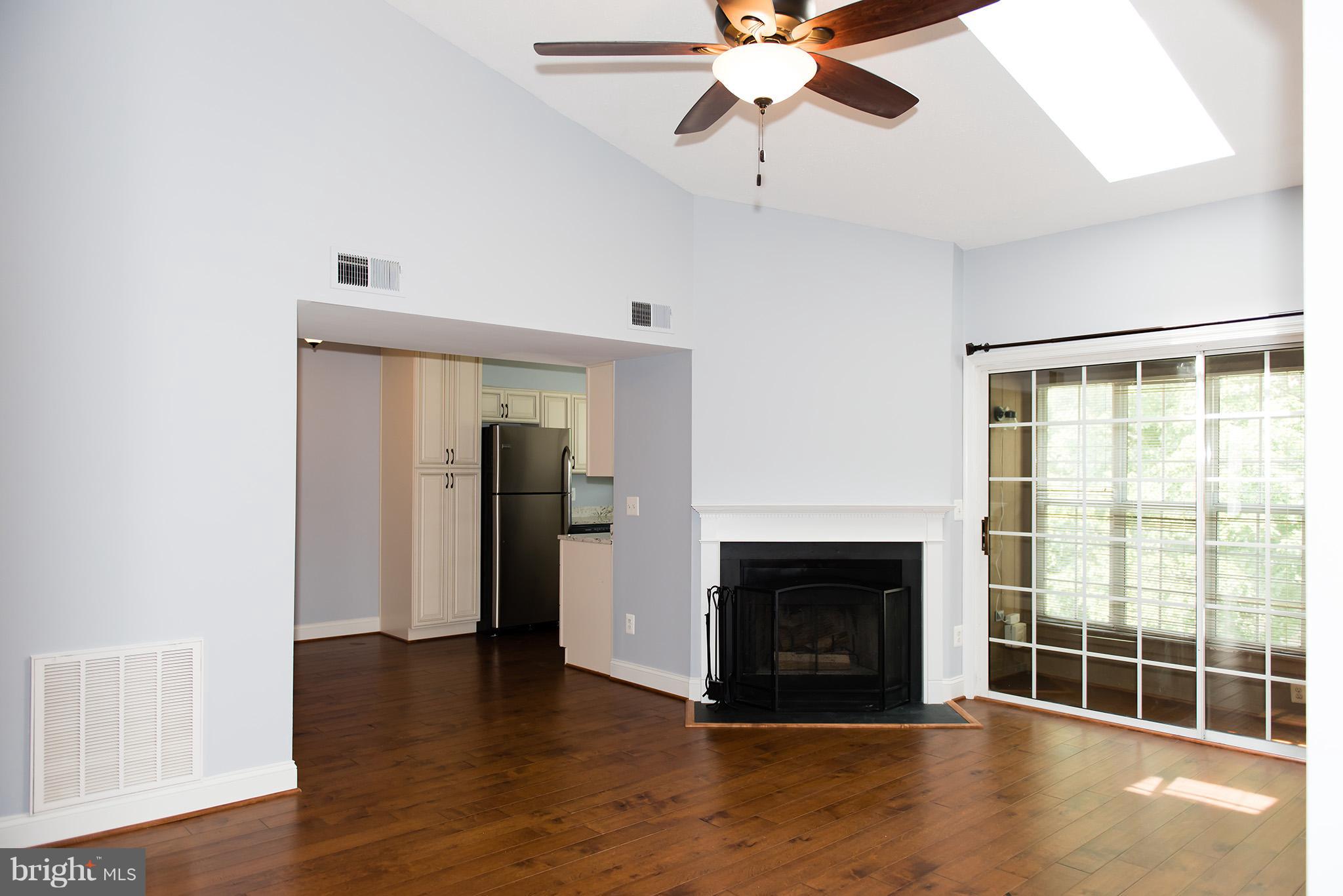 110 Fort Evans Road Southeast, Unit E Leesburg, VA 20175 - Photo 2 of 14 Gorgeous living Room with fireplace and sunroom