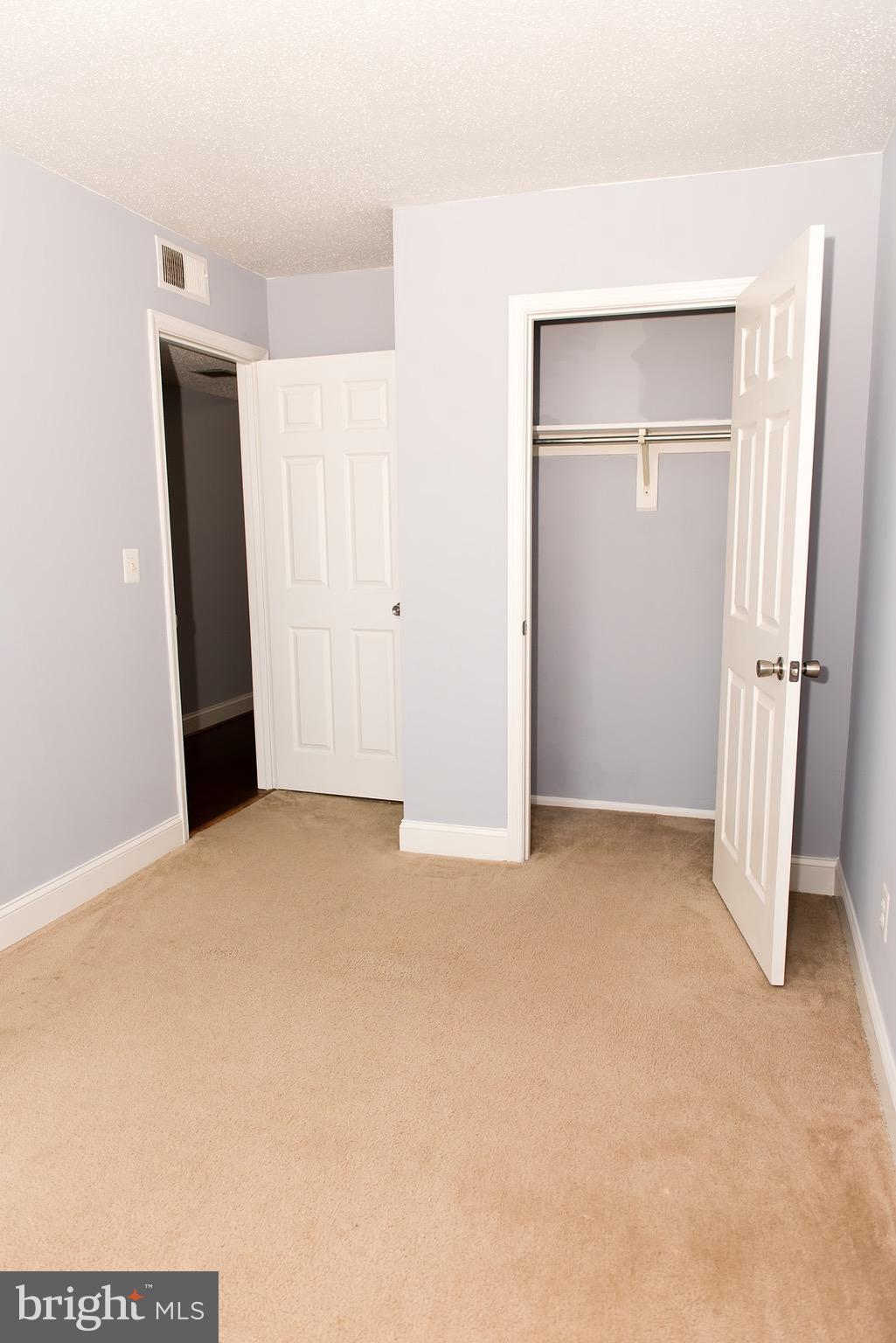 110 Fort Evans Road Southeast, Unit E Leesburg, VA 20175 - Photo 12 of 14 Bedroom has a spacious closet