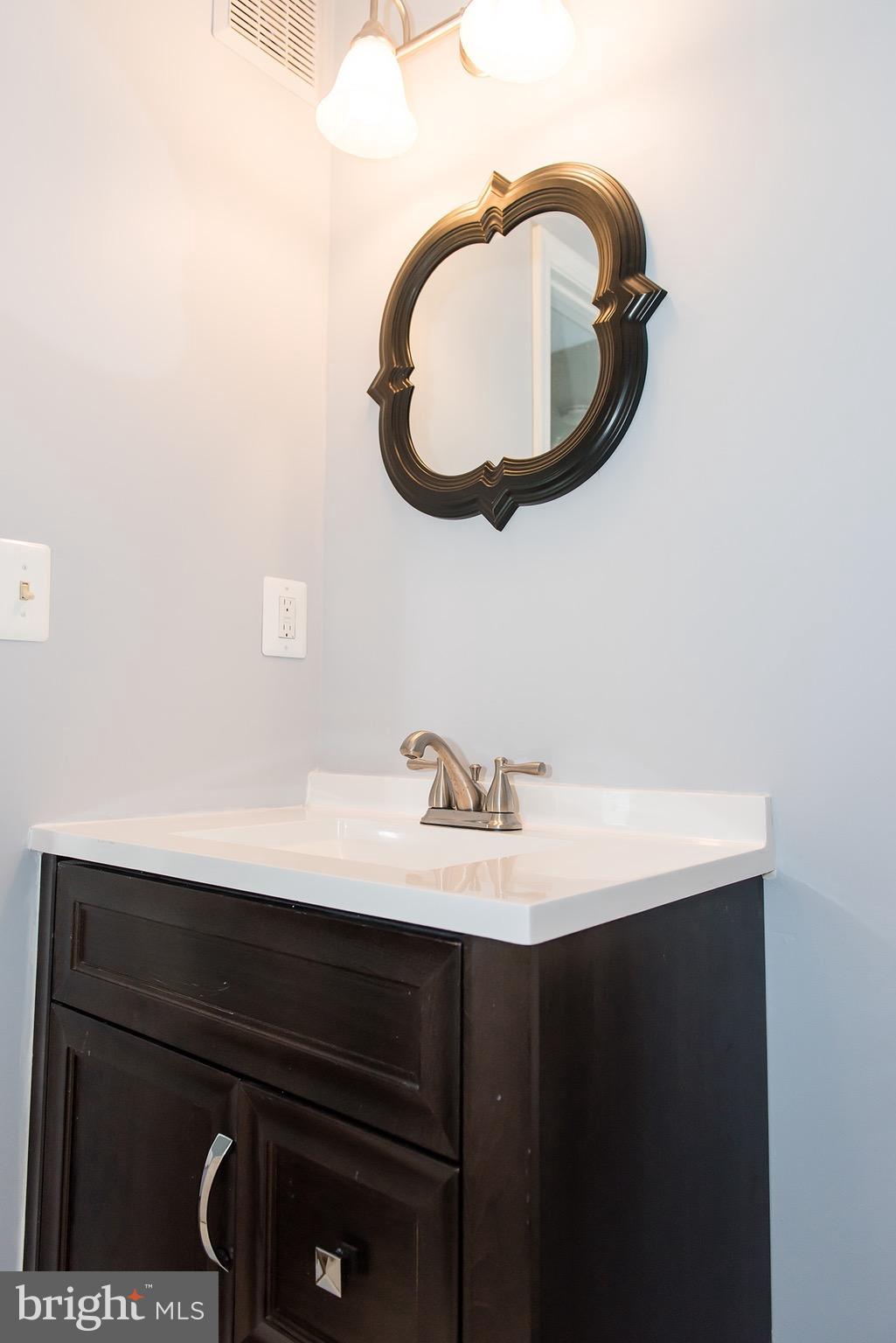 110 Fort Evans Road Southeast, Unit E Leesburg, VA 20175 - Photo 14 of 14 Full bath with a new vanity and light fixture