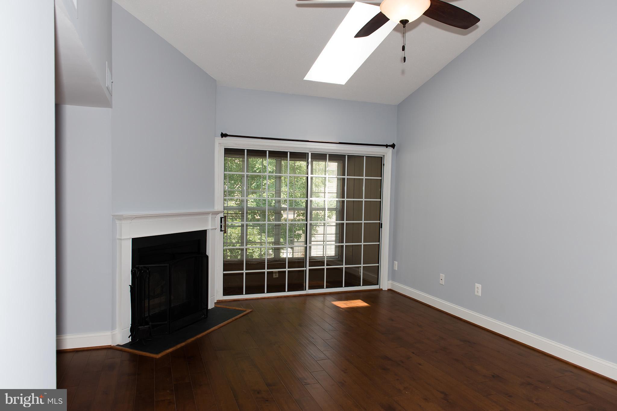 110 Fort Evans Road Southeast, Unit E Leesburg, VA 20175 - Photo 3 of 14 Living Room with the all season sunroom