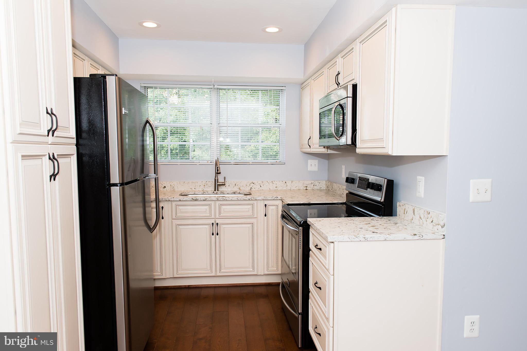 110 Fort Evans Road Southeast, Unit E Leesburg, VA 20175 - Photo 6 of 14 Completely updated kitchen with granite countertop