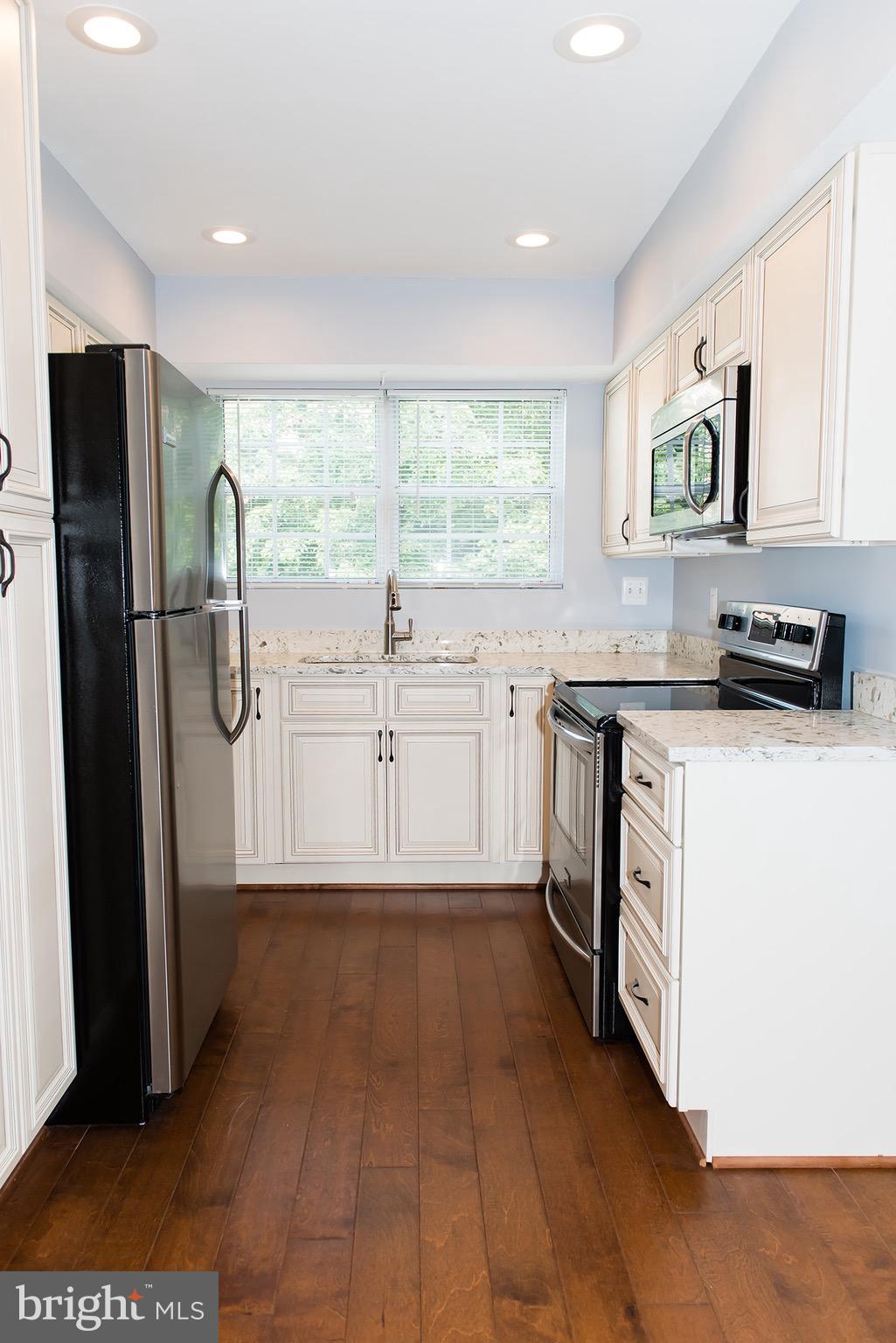 110 Fort Evans Road Southeast, Unit E Leesburg, VA 20175 - Photo 7 of 14 Kitchen has a lot of light