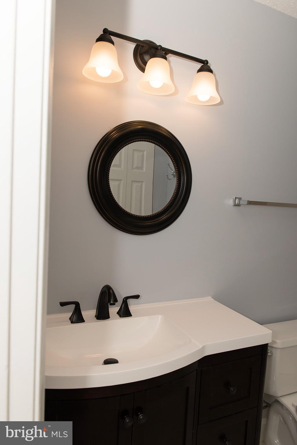 110 Fort Evans Road Southeast, Unit E Leesburg, VA 20175 - Photo 10 of 14 Bath (Master) has a new vanity and light fixture