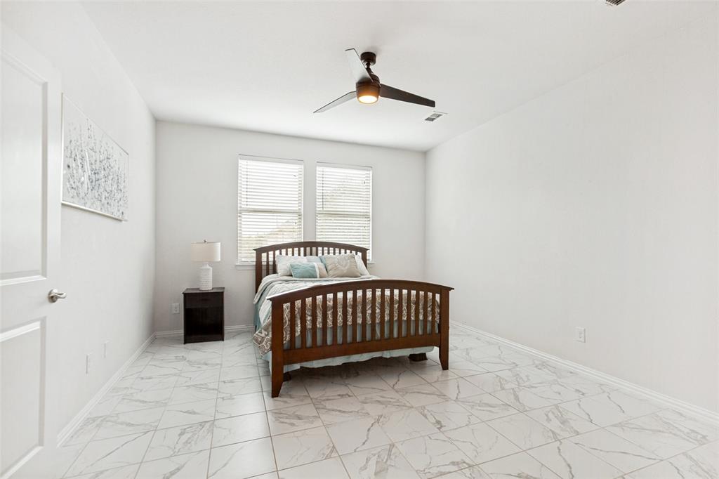 605 Ansley Way Allen, TX 75013 - Photo 19 of 28 Room featuring light-toned walls, square tile flooring with a subtle veining pattern, and a ceiling fan with integrated lighting