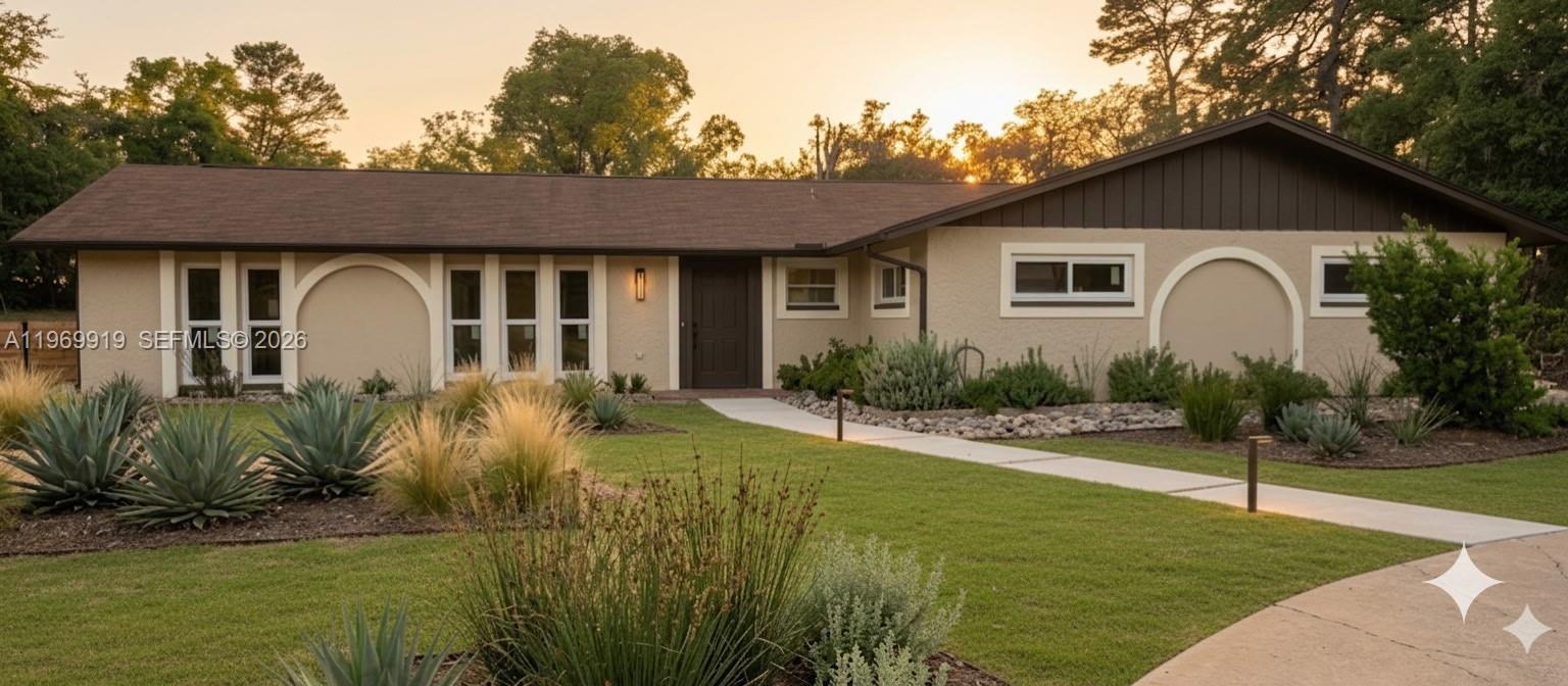 a front view of a house with garden