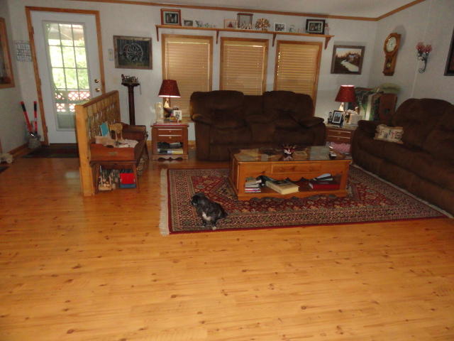 2592 Hinote Road DeFuniak Springs, FL 32433 - Photo 8 of 46 a living room with furniture and a flat screen tv