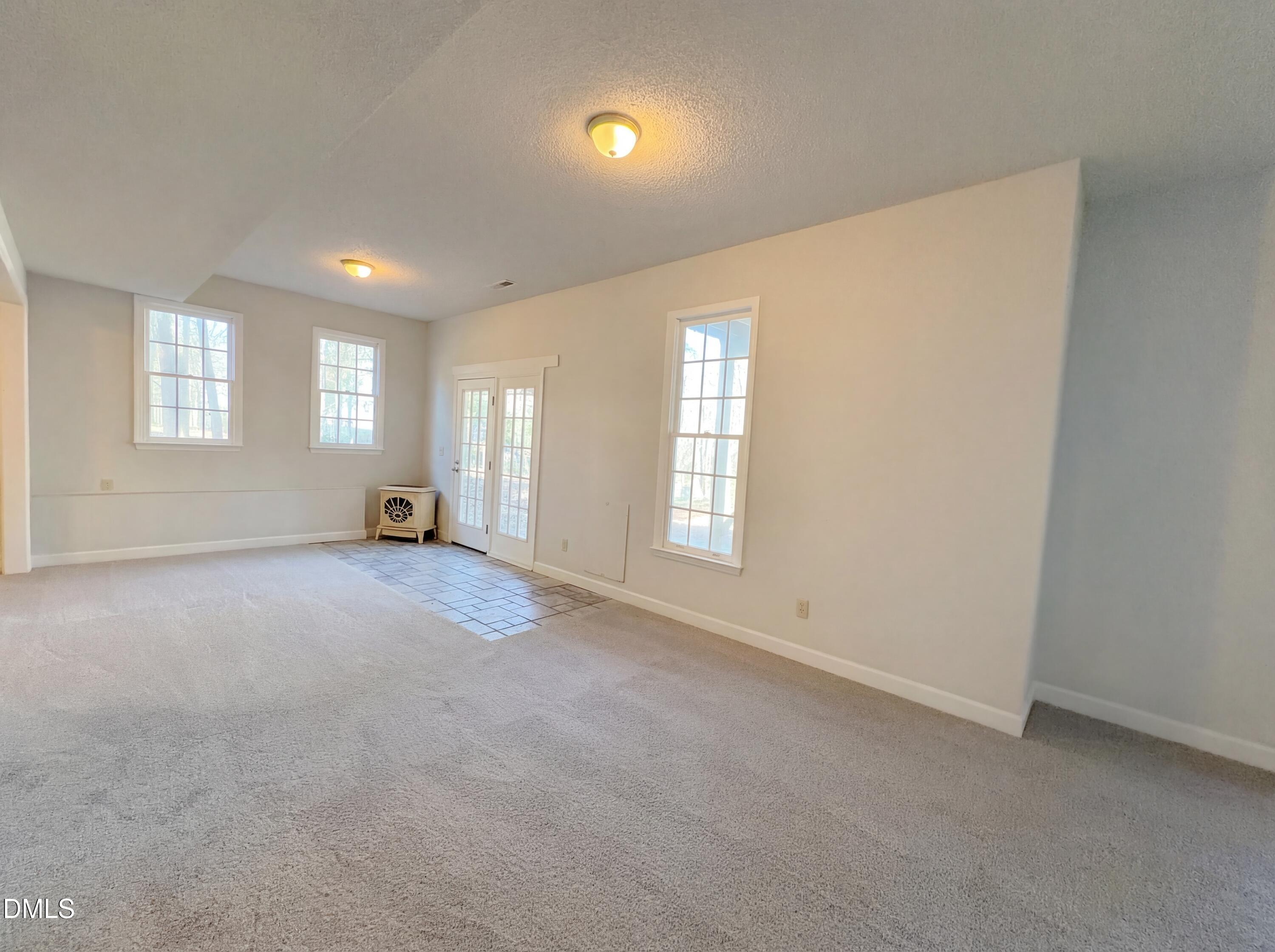 3117 Twatchman Drive Raleigh, NC 27616 - Photo 8 of 27 an empty room with a window