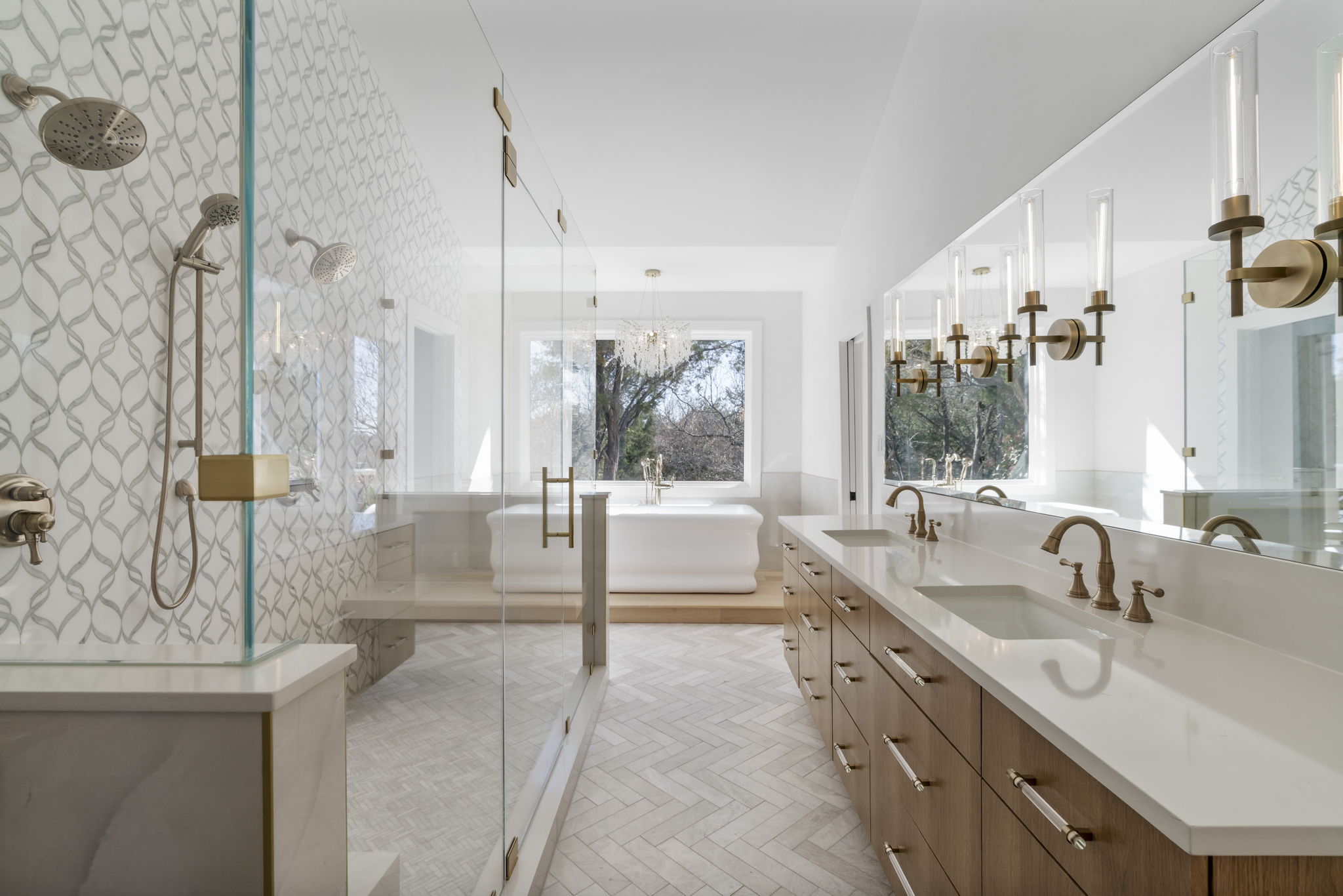 701 Furlong Drive Austin, TX 78746 - Photo 17 of 40 a bathroom with double vanity and a bathtub